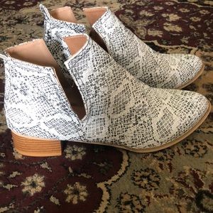 Snake print ankle boots.